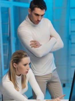 picture of man and woman in space laboratory