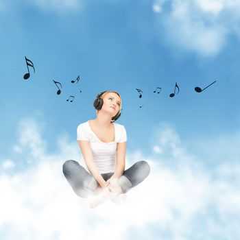 picture of happy teenage girl in big headphones sitting on cloud