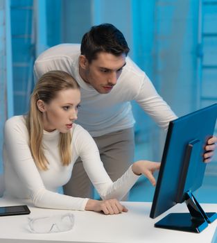 picture of man and woman in space laboratory