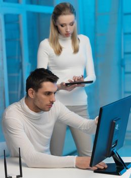 picture of man and woman in space laboratory