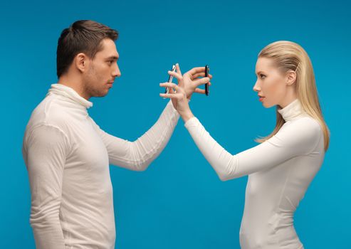 picture of man and woman with modern gadgets