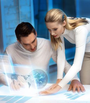 picture of man and woman working with virtual screen