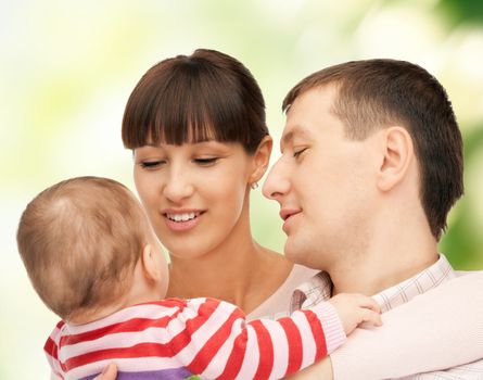 picture of happy mother and father with adorable baby (focus on man)