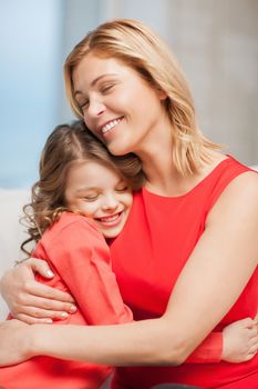 bright picture of hugging mother and daughter