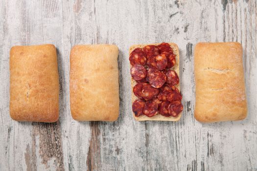 Sausage on a table and a bread tray