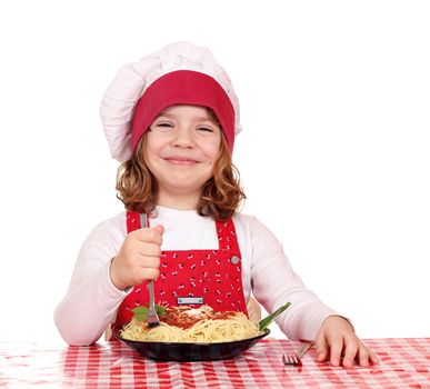 happy little girl cook eat spaghetti