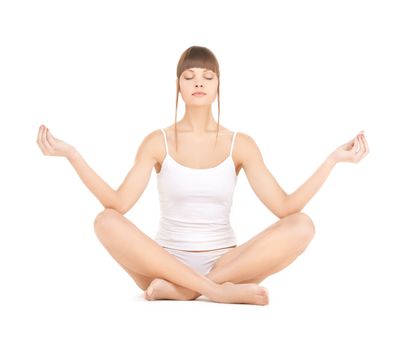 sporty woman in cotton underwear practicing yoga lotus pose