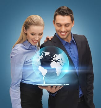 man and woman with virtual globe from tablet pc