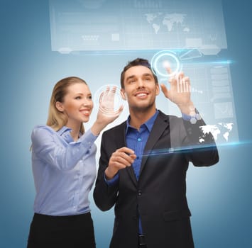 picture of man and woman working with virtual touch screens