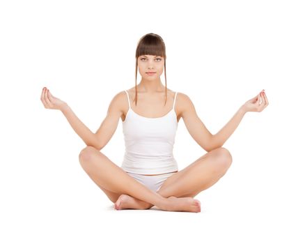 sporty woman in cotton underwear practicing yoga lotus pose