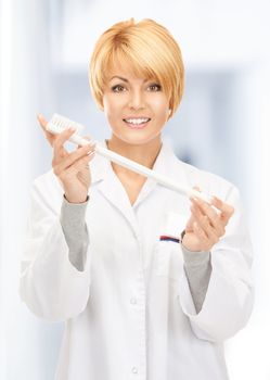 picture of attractive female doctor with toothbrush