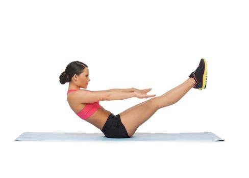 beautiful sporty woman doing exercise on the floor