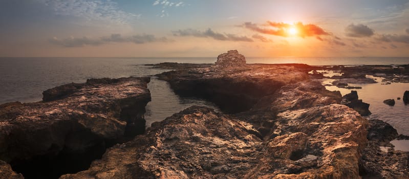 Sunset over the Sea and Rocky Coast with Ancient Ruins in Mahdia, Tunisia