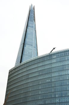 London shard with glass building in foreground