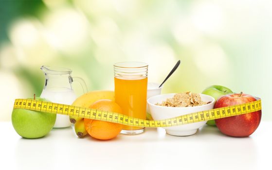 close up of healthy breakfast and measuring tape