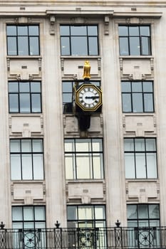 Urban antique clock on building