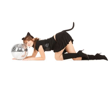 playful girl in cat costume sneaking up to glitter ball
