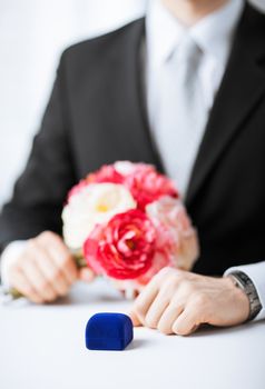 picture of man with gift box in suit