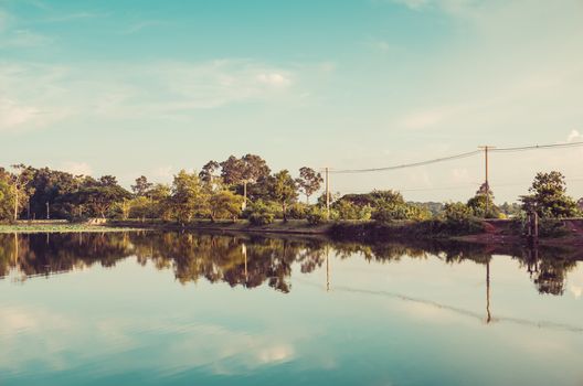 Pond and water reflection in spring nature in Thailand vintage