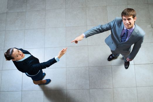 image of a two businessmen hands pointing to each other