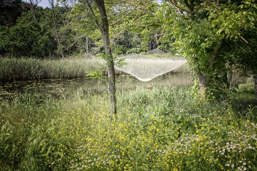 Fishing hut on the Pialassa della Baiona brackish lagoon near Marina Romea along te  Adriatic seaside in Ravenna (Italy)