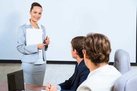 image of a discusses business woman with colleagues