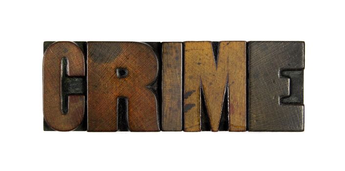 The word CRIME written in vintage wood letterpress type