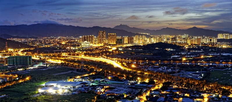 HongKong Asian city sunset , Yuen Long district, highway and paddy field rice , shooting at Kai Kung Leng