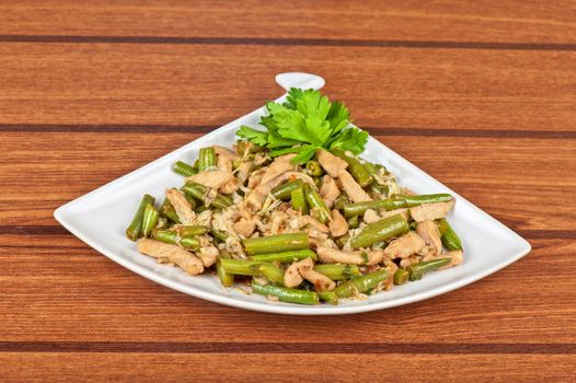 Tasty green beans with chicken meat