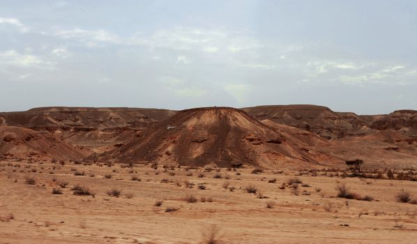 An Egyptian Desert And Mysty Sky in the daylight