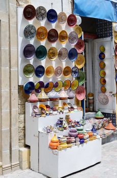 Morocco shop front in Marrakesh selling colorful tajin and bowls