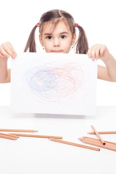 young girl with drawig pencil at white table