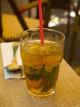 Glass of cold refreshing  ice tea served on a table