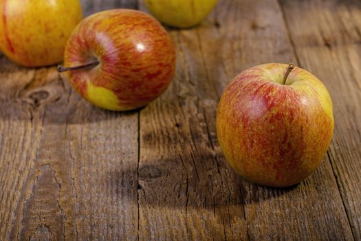 apples on a wooden table.