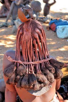 Ochre colored hair of a Himba woman indicating her mature status

