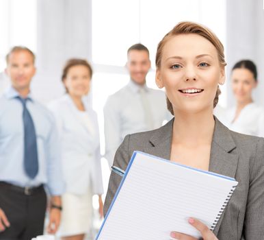 picture of happy woman with big notepad