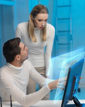 futuristic man and woman working with virtual screen