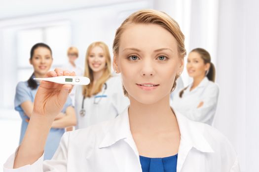 picture of attractive female doctor with thermometer