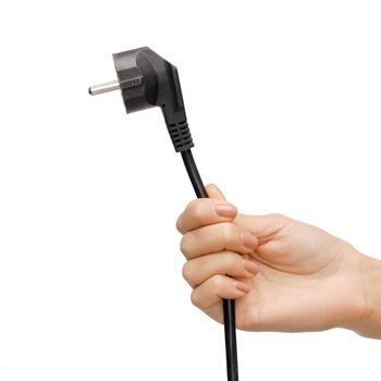 close up of hand holding black electrical plug with wire