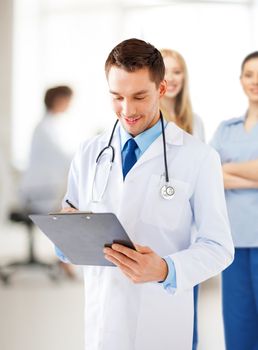 bright picture of male doctor writing prescription