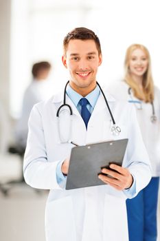 bright picture of male doctor writing prescription