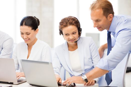 picture of group of people working in call center or office