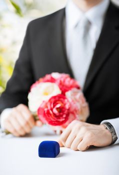 picture of man with gift box in suit