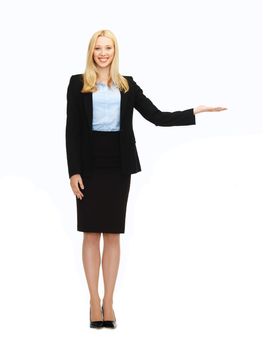 business and education - woman showing something imaginary on her hand