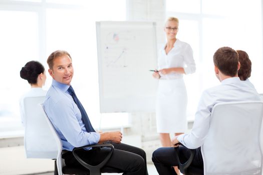 picture of smiling businessman on business meeting in office