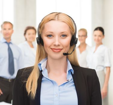 friendly helpline operator with headphones in call centre