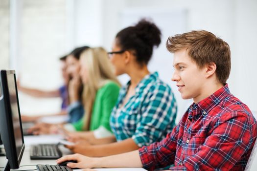 education concept - student with computer studying at school