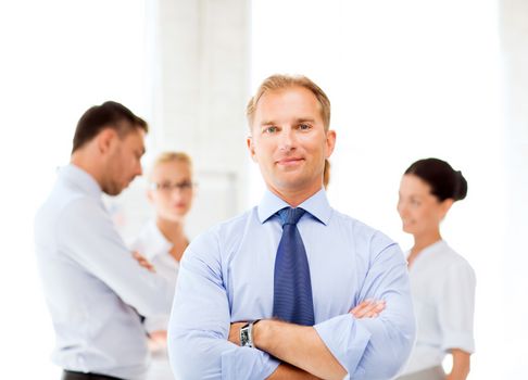 picture of smiling handsome businessman in office