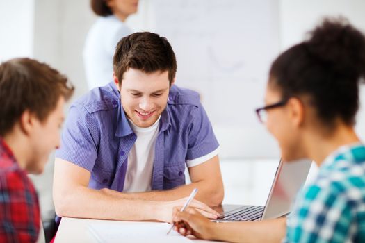 education concept - group of students studying at school