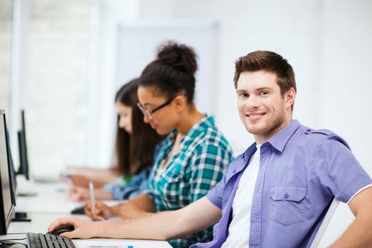 education concept - student with computer studying at school